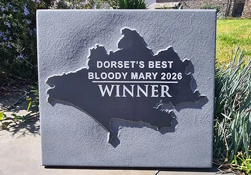 Lettering was engraved into the raised centre. Raised Slate Centre
