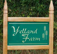Simple entrance sign with gothic posts tops
