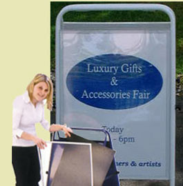 Sandwich board with wording on panel