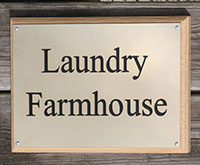Engraved brass house sign.