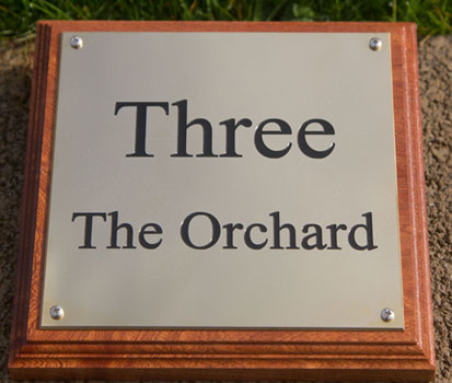 Engraved brass house sign