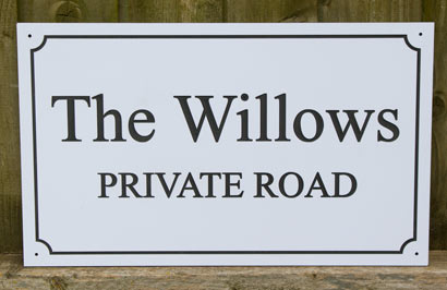 Large engraved house sign - line border with indented corners.
