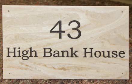 House sign in stone like marble corian