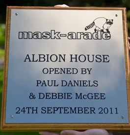 Deep engraved stainless steel plaque on a backing board