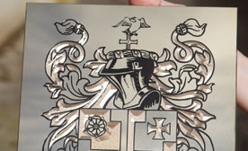 Engraved brass family crest
