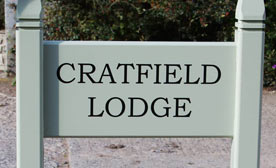 Painted and natural oak entrance signs