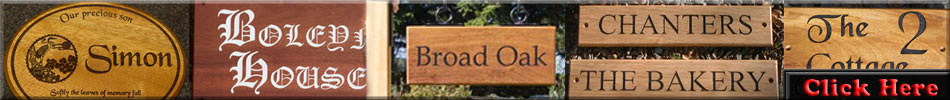 Click here to see lots of wooden house signs