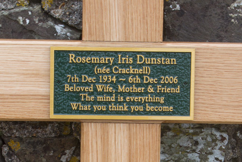 Bronze memorial plaque fixed to an extra large oak cross