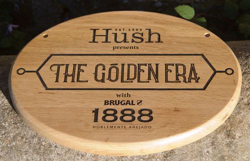 Oval oak sign with detailed text