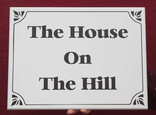 White painted house sign