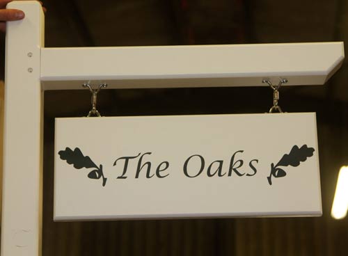 Double sided hanging house sign