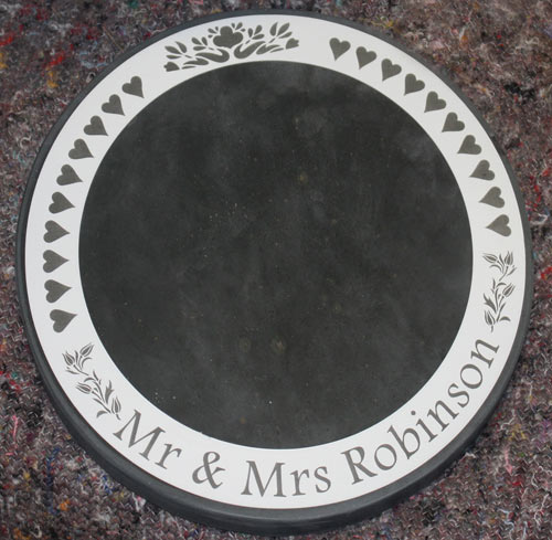Inlaid engraved panel on slate cake stand or table centres.