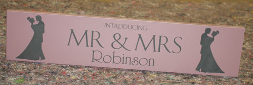 A painted slate top table sign with supports to make it stand