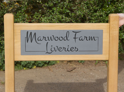 Superior entrance signs using engraved corian and solid oak