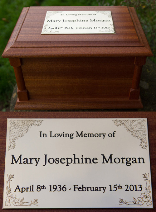 Brass plaque on a mahogany ash casket