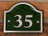 Polished aluminium arch top house number.