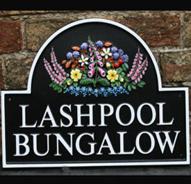 Cast house sign - foxglove motif with extra foxgloves painted on