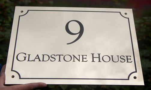 Large brass slate house sign.