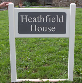 Painted entrance sign with engraved corian panel