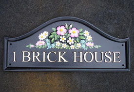 Arch top house sign.