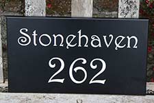 Painted hardwood address signs.