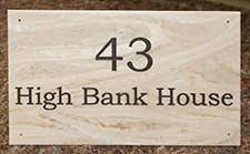 Engraved marble corian address sign.