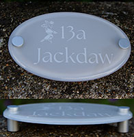 Painted and etched clear acrylic house name sign.