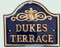 Small cast brass house sign