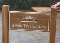 Natural wood entrance sign
