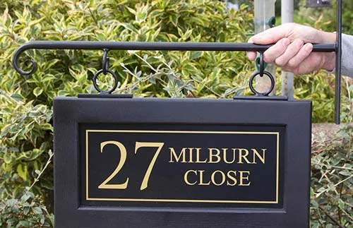 Hanging house sign paired with scroll end bracket Black Framed Hanging Sign