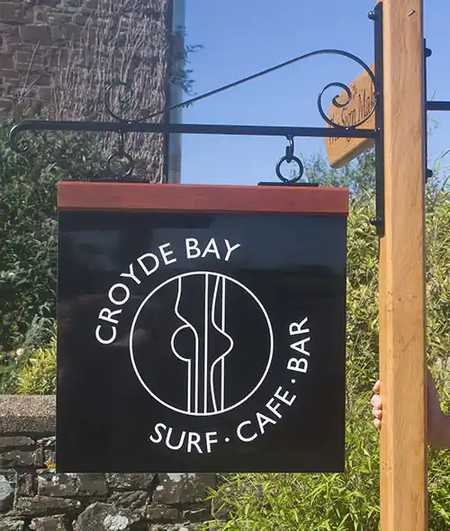 A hanging sign with a much more modern feel to it. Contemporary Hardwood Header Hanging Sign.