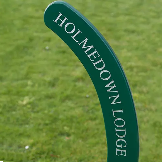 Painted wooden hockey stick sign