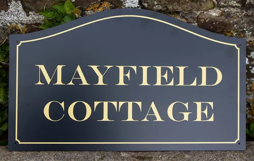 Arch top house sign, black with gold lettering