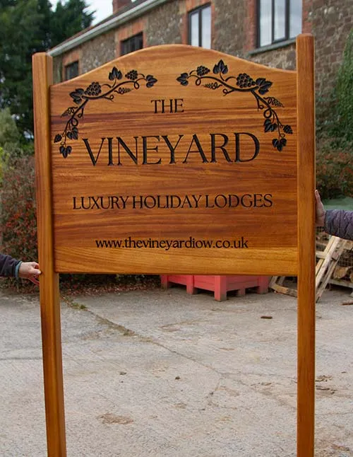 This sign has been morticed into the posts. Iroko Sign on Posts