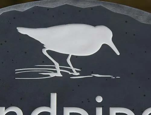 Silhouette style image sandblasted into slate. Sandblased Image in Slate