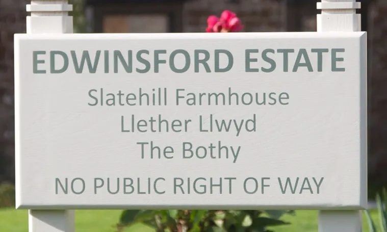 title here Painterd sign with lettering in Farrow and Ball Smoke Green and background in Slipper Satin