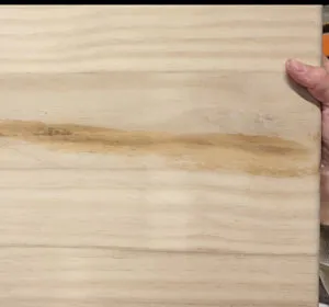 Close up of sanded sign with water damage to sign