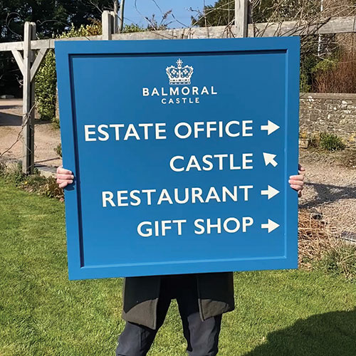 title here Painted wooden signs crafted by The Sign Maker for businesses and estates.