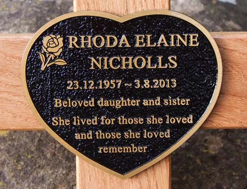 Cast bronze is the ultimate material for memorial plaques. Cast Bronze Heart Spaped Plaque on a Wooden Cross