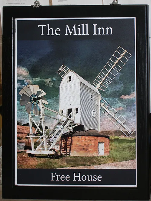 Black framed printed hanging pub sign with image of a windmill