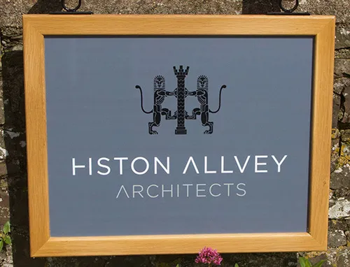 Wood framed hanging sign with cut and printed vinyl lettering and text