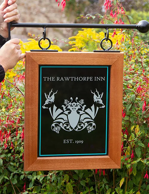 Wood framed sign with printed vinyl information and logo for veterinary practice