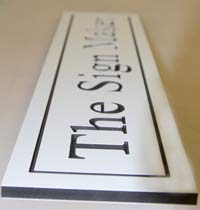 Deep engraved white PVC with black core
