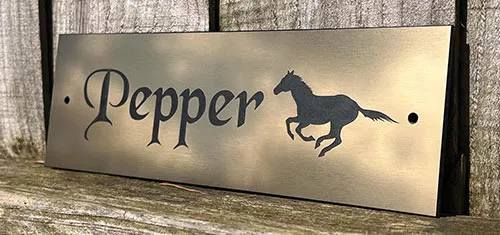 Durable acrylic horse name plate with bold black lettering
