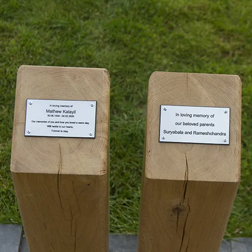 Green oak plinths with engraved plaques
