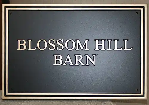 title here Rectangular cast house sign