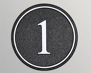 title here Round cast house number sign