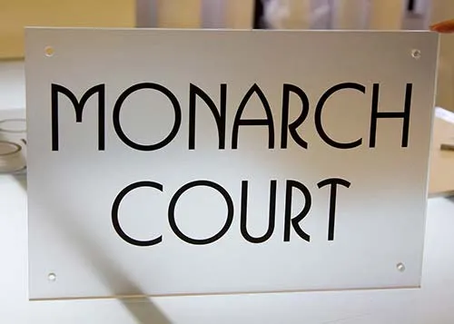 This sign is fixed with stand away fixungs which are included. Clear Acrylic Sign