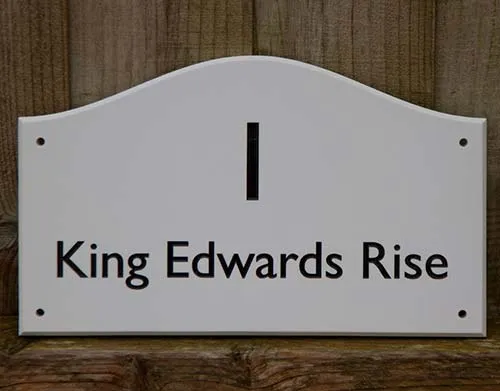 The lettering is engraved into the corian. White Corian Address Sign