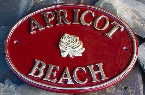 title here Brass House Sign